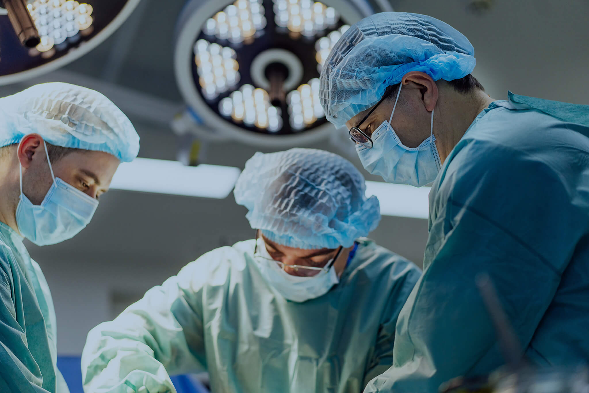 Surgeons in a complex hospital operation.
