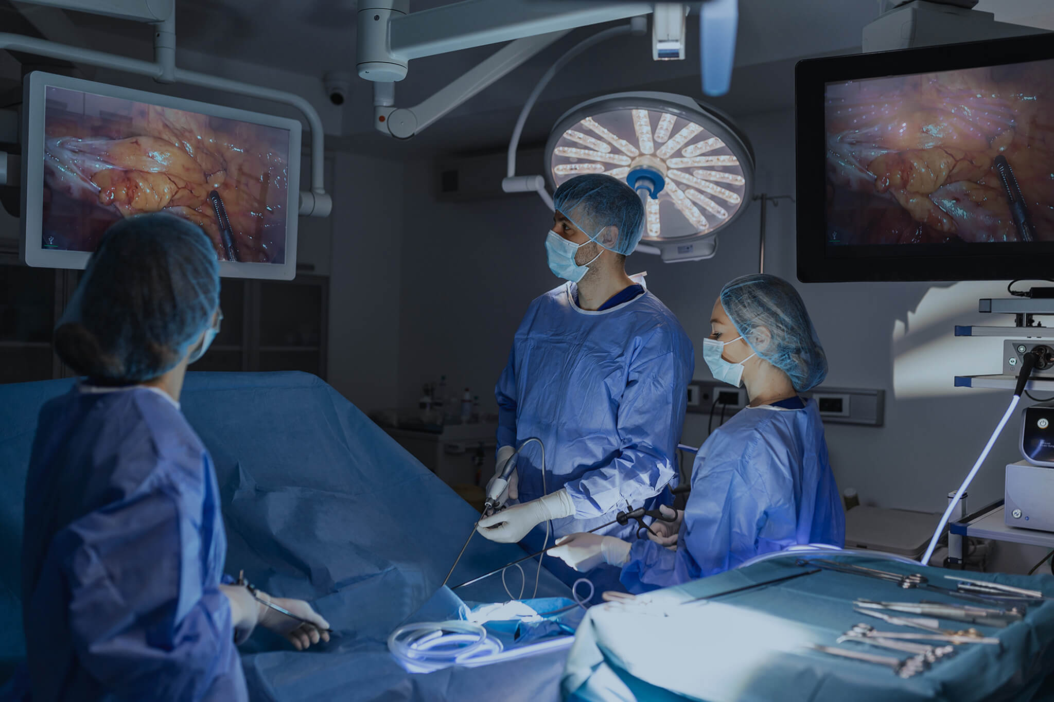 The surgeon's doing endoscopy surgery in the operating room.