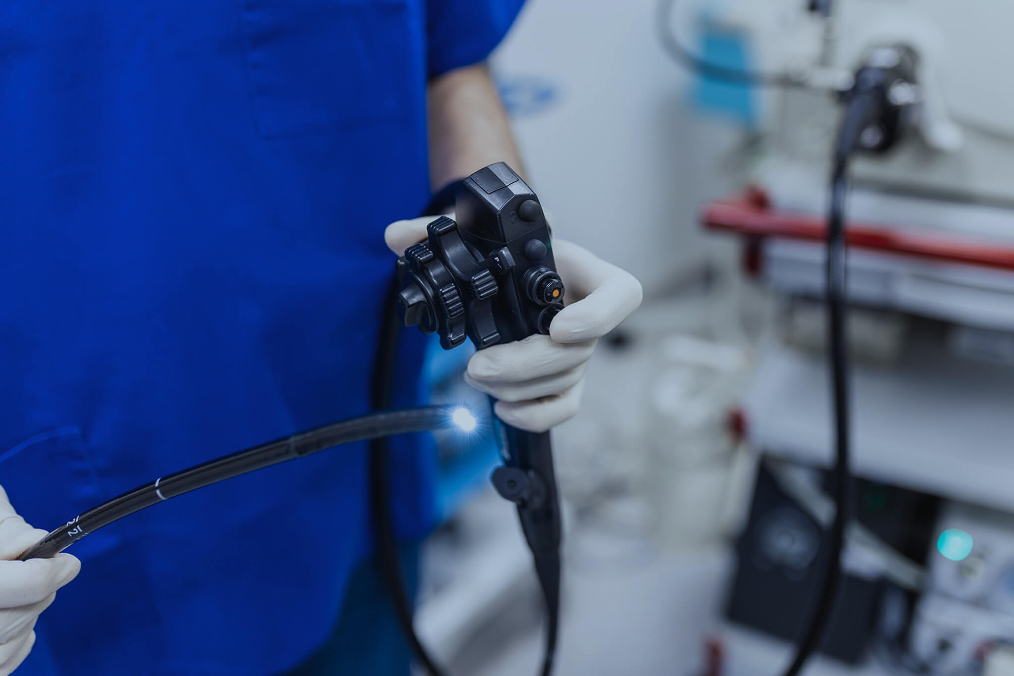 Doctor holding endoscope device.