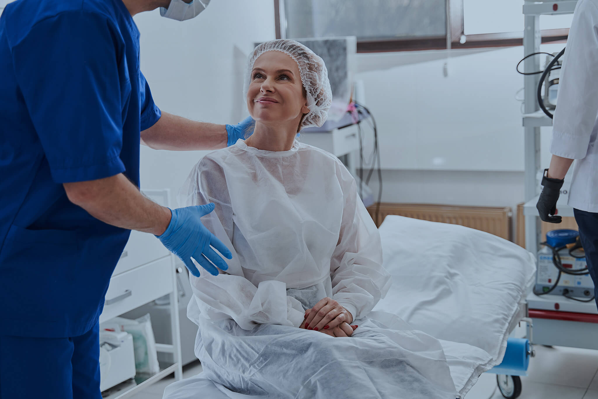Doctor calming his patient before the endoscopy.