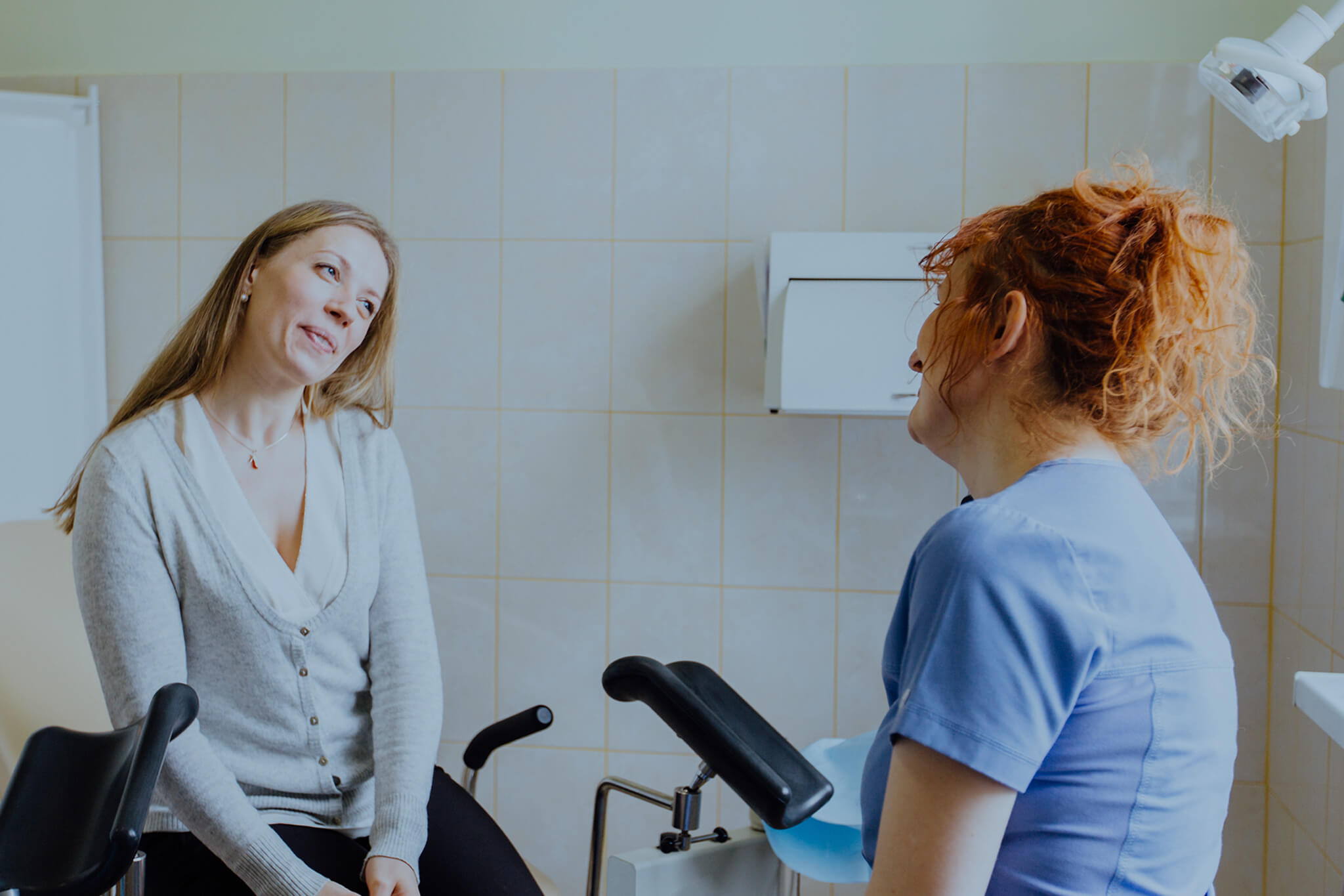 Gynecologist consulting with her patient.