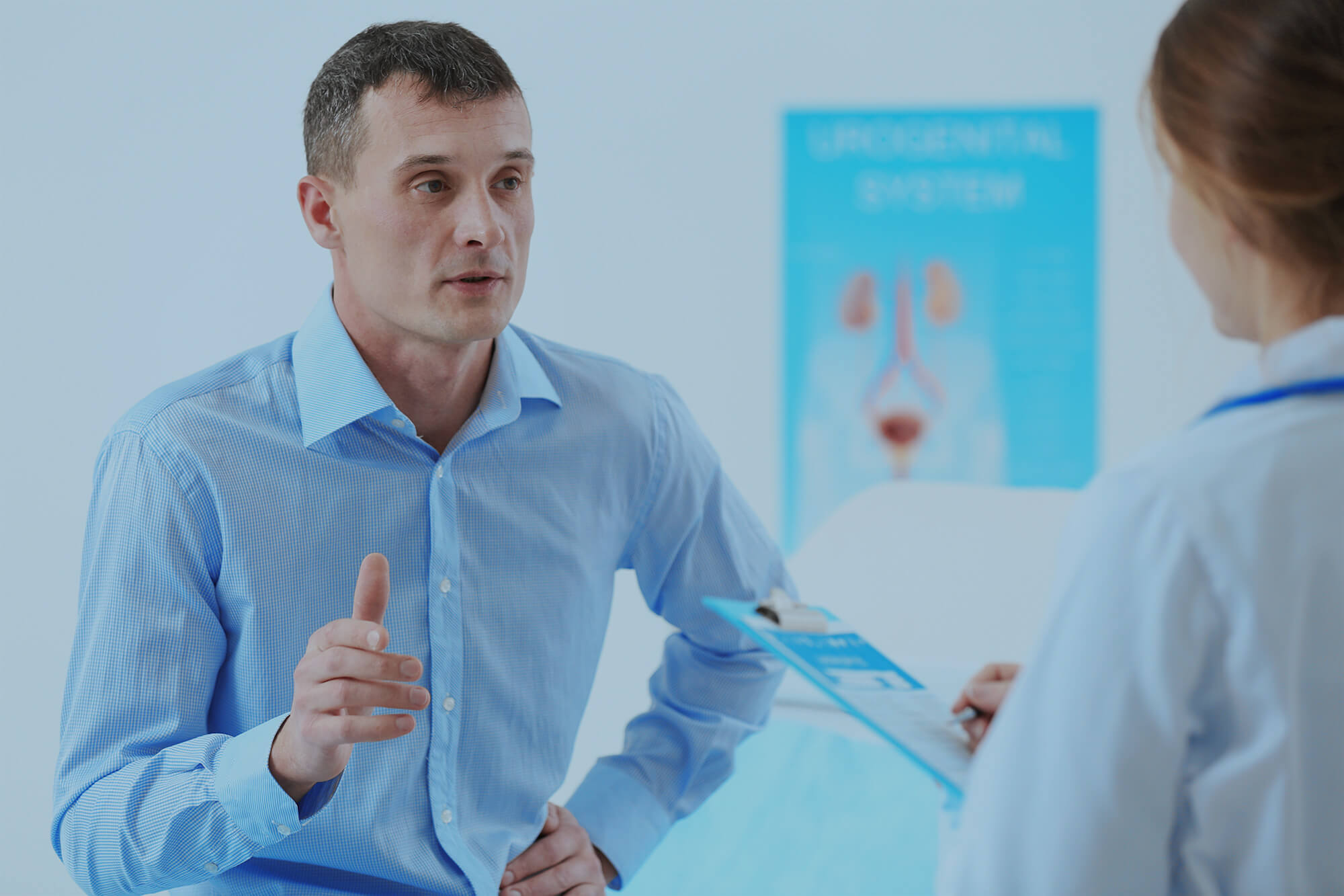 Patient talking with urologist at hospital.